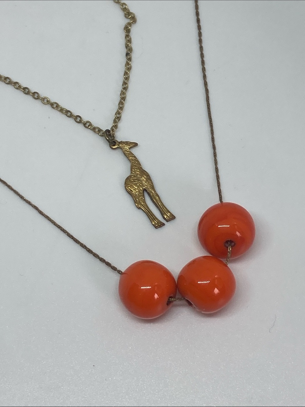Gold Giraffe Pendant Necklace with Bright Orange Bead Strand